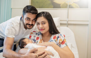 Vinay, his wife and their new baby