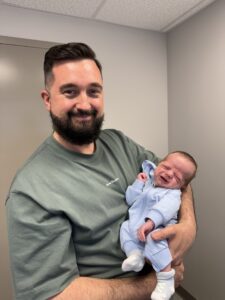 Dr. André LaRoche and baby Anthony